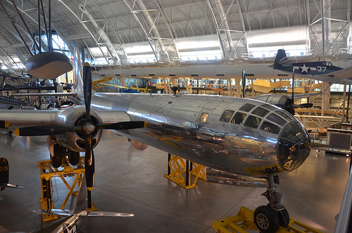 Steven F. Udvar-Hazy Center: Boeing B-29 Superfortress “Enola Gay” (front starboard view), with Grumman F6F-three Hellcat at back-right, among other folks
